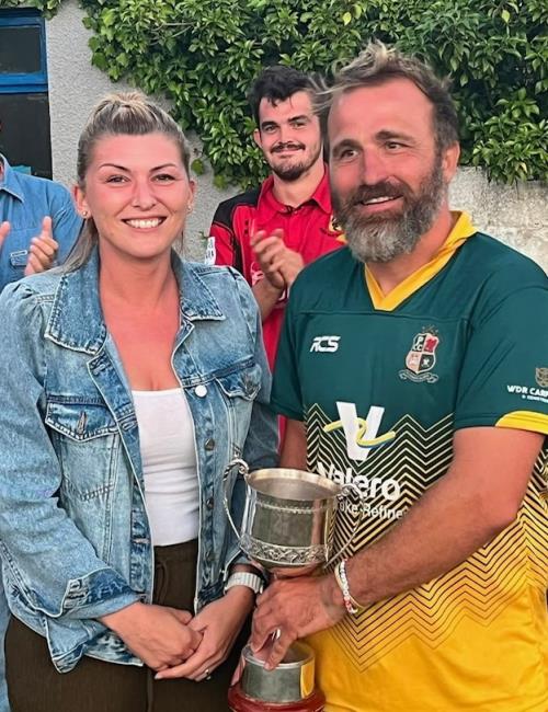 Toby Bradley-Watson receives the trophy from Kens granddaughter Charlene Toby Bradley-Watson receives the trophy from Kens granddaughter Charlene